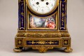 Zegar kominkowy w oprawie z porcelany, 